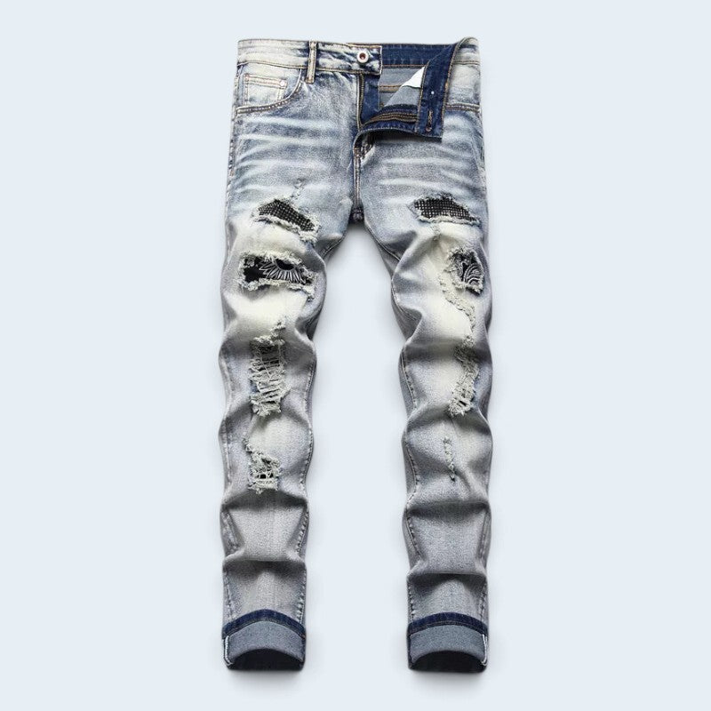 Męskie jeansy slim fit z przetarciami i kolorowymi naszywkami