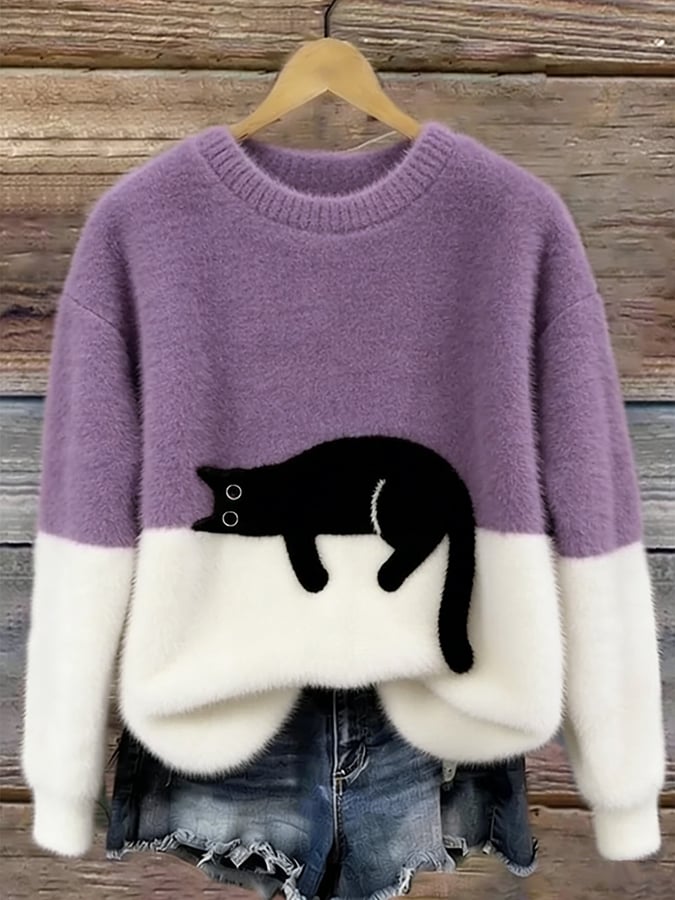Damski sweter oversize z kontrastowym wzorem i czarnym motywem kota