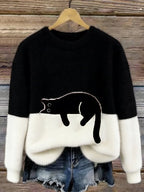 Damski sweter oversize z kontrastowym wzorem i czarnym motywem kota