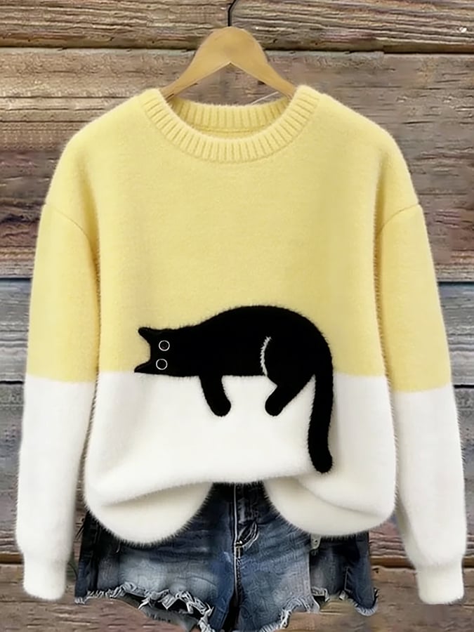 Damski sweter oversize z kontrastowym wzorem i czarnym motywem kota