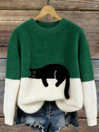 Damski sweter oversize z kontrastowym wzorem i czarnym motywem kota