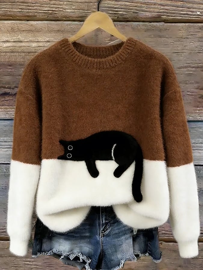 Damski sweter oversize z kontrastowym wzorem i czarnym motywem kota