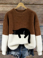 Damski sweter oversize z kontrastowym wzorem i czarnym motywem kota