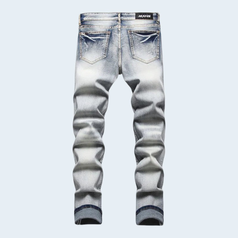 Męskie jeansy slim fit z przetarciami i kolorowymi naszywkami