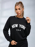 Női fekete melegítőfelső New York felirattal, kerek nyakkivágással