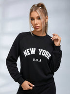 Női fekete melegítőfelső New York felirattal, kerek nyakkivágással