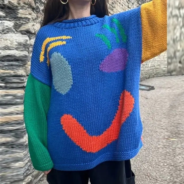 Damski sweter oversize z dzianinowym motywem uśmiechu