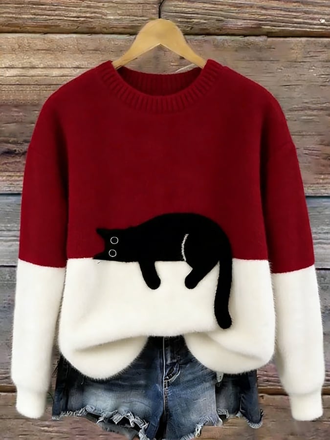 Damski sweter oversize z kontrastowym wzorem i czarnym motywem kota